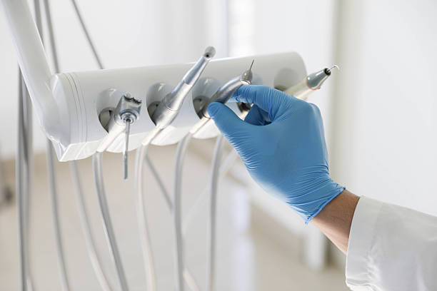 Professional Tooth Extraction technician working in Arcadia, LA